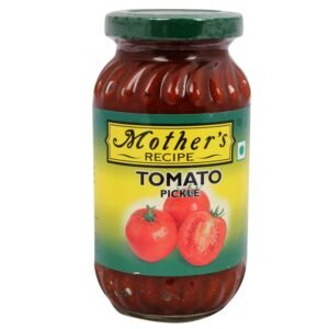 Jar of Mothers Recipe Tomato Pickle with spices and ripe tomatoes