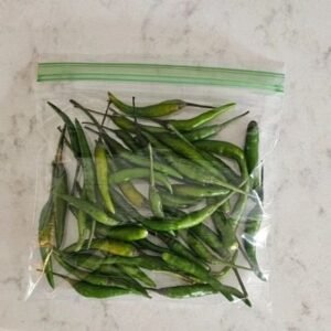 Small green chillies in a 50g package