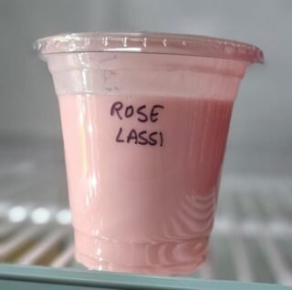 A refreshing glass of Rose Lassi made with real roses and yogurt