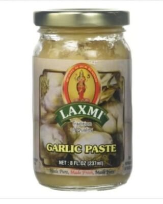 Laxmi Garlic Paste in a jar, ideal for enhancing dishes with authentic flavor.