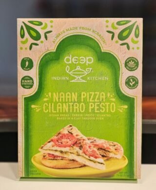 Cilantro pesto naan pizza from Deep Indian Kitchen, showcasing a fusion of Indian and Italian flavors.