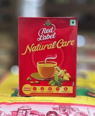 Red Label Natural Care Tea package, 250g, promoting health and wellbeing.