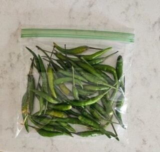 Small green chillies in a 50g package